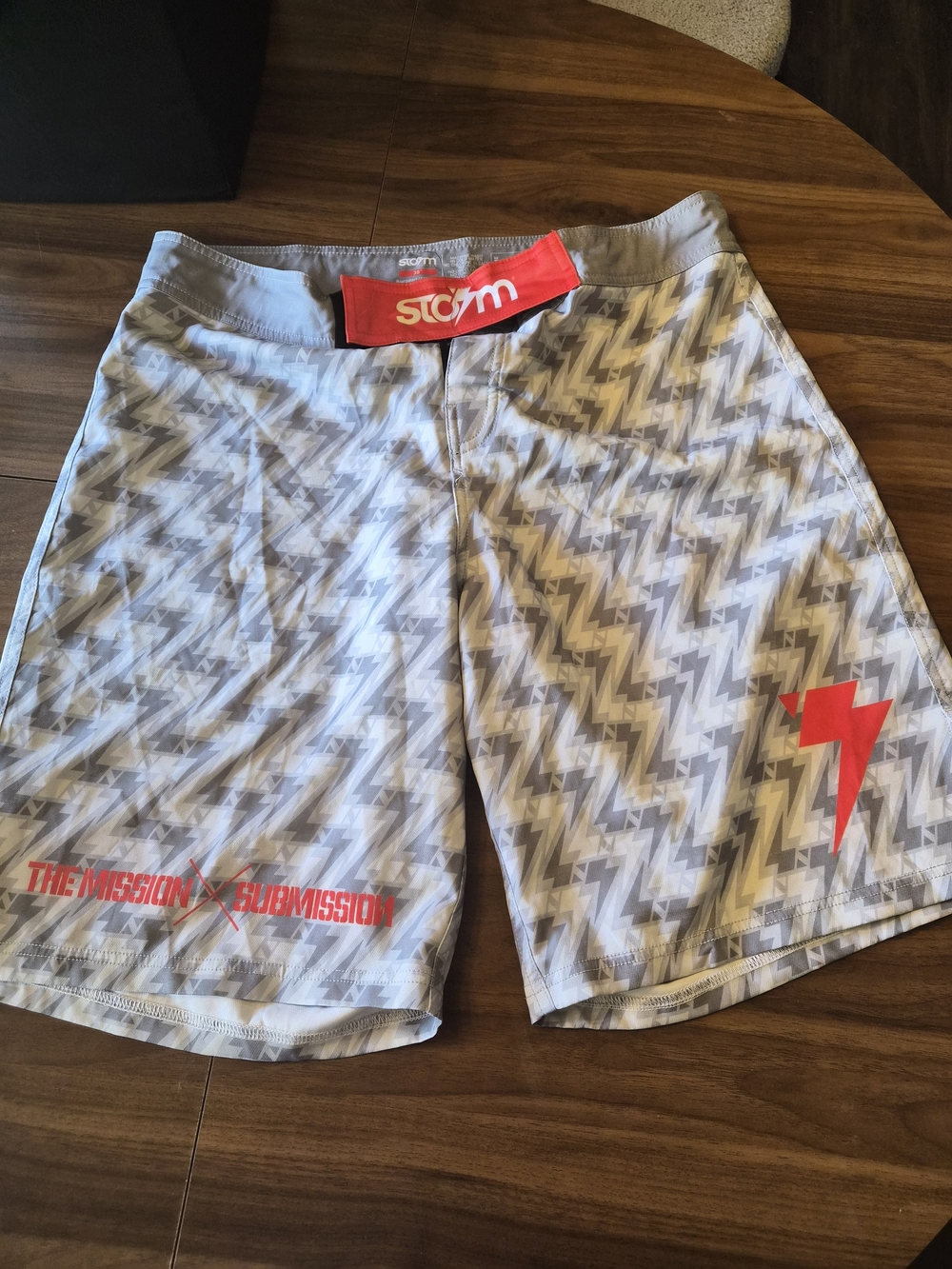 Storm Men's Light Gray Zigzag Fight Shorts with Red Accents